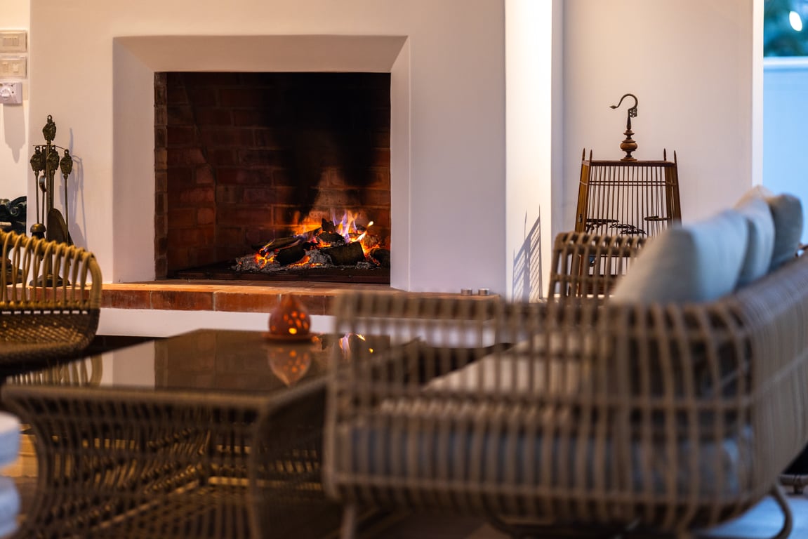 Lounge by the fireplace at Baan SaranTaya